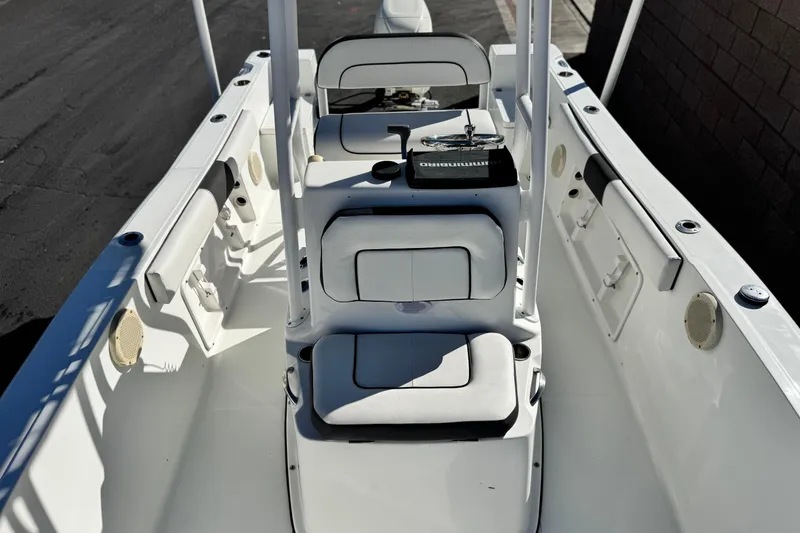 Slide: The Image of 2021 Clearwater 2000 C/C boat interior with seating and console, showcasing sleek design. - 14