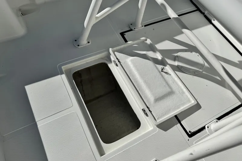 Slide: The Image of Open storage compartment on a 2021 Clearwater 2000 C/C boat deck. - 24