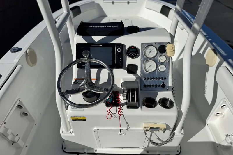 Slide: The Image of Center console of 2021 Clearwater 2000 C/C boat with steering wheel and gauges. - 26