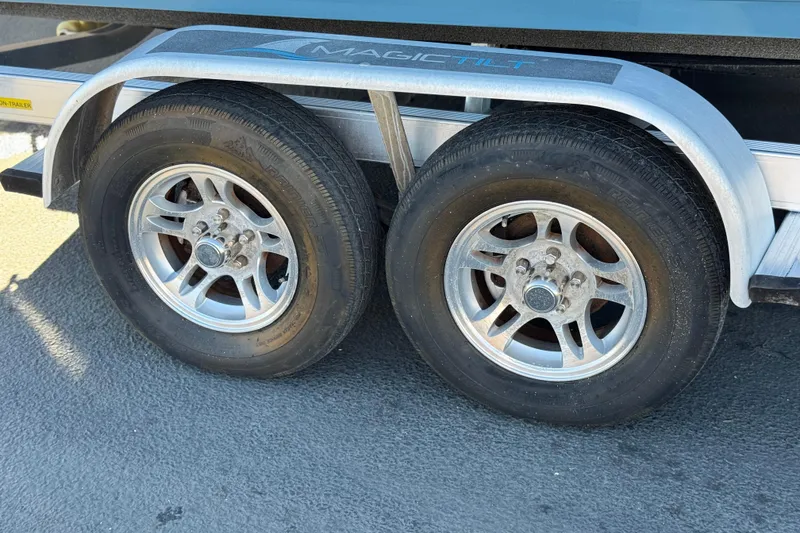 Slide: The Image of Trailer wheels of a 2021 Clearwater 2000 C/C boat on Magic Tilt trailer. - 29