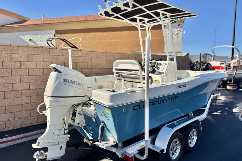 Slide: The Image of 2021 Clearwater 2000 C/C boat with Suzuki outboard motor on trailer. - 5