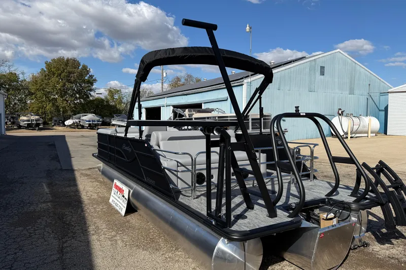 Slide: The Image of 2026 Bentley Pontoons Legacy 243 Swingback in a boatyard under a clear blue sky. - 10