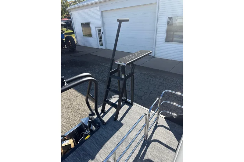 Slide: The Image of 2026 Bentley Pontoons Legacy 243 Swingback with sleek deck and ladder design. - 14