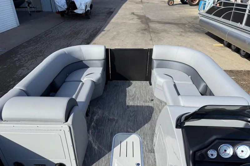 Slide: The Image of 2026 Bentley Pontoons Legacy 243 Swingback interior with gray seating and modern dashboard. - 15