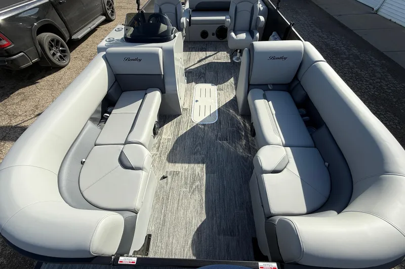 Slide: The Image of 2026 Bentley Pontoons Legacy 243 Swingback interior with luxurious gray seating. - 18