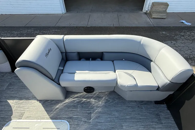 Slide: The Image of 2026 Bentley Pontoons Legacy 243 Swingback interior seating, featuring luxurious gray upholstery. - 22