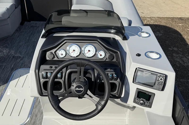 Slide: The Image of 2026 Bentley Pontoons Legacy 243 Swingback dashboard with steering wheel and gauges. - 25