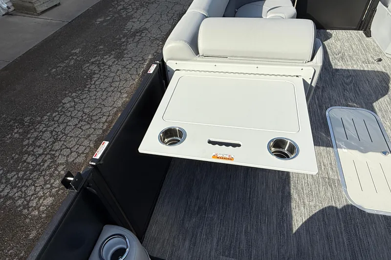 Slide: The Image of 2026 Bentley Pontoons Legacy 243 Swingback interior with table and cup holders. - 30