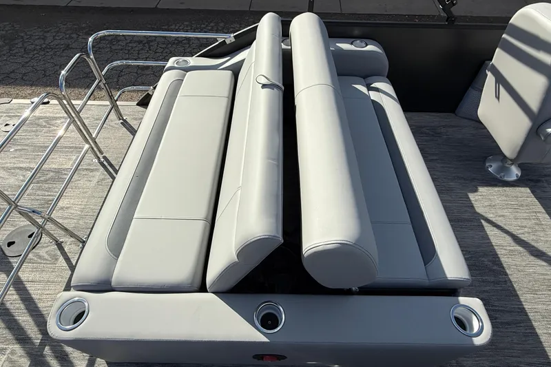 Slide: The Image of 2026 Bentley Pontoons Legacy 243 Swingback seating with cup holders and sleek design. - 32