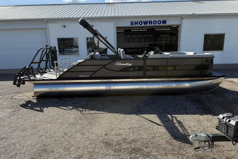 Slide: The Image of 2026 Bentley Pontoons Legacy 243 Swingback displayed outside a showroom. - 5