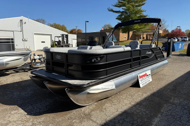 Slide: The Image of 2026 Bentley Pontoons Legacy 243 Swingback, black exterior, parked outdoors on a sunny day. - 8