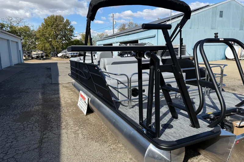 Slide: The Image of 2026 Bentley Pontoons Legacy 243 Swingback, black exterior, docked outdoors. - 9