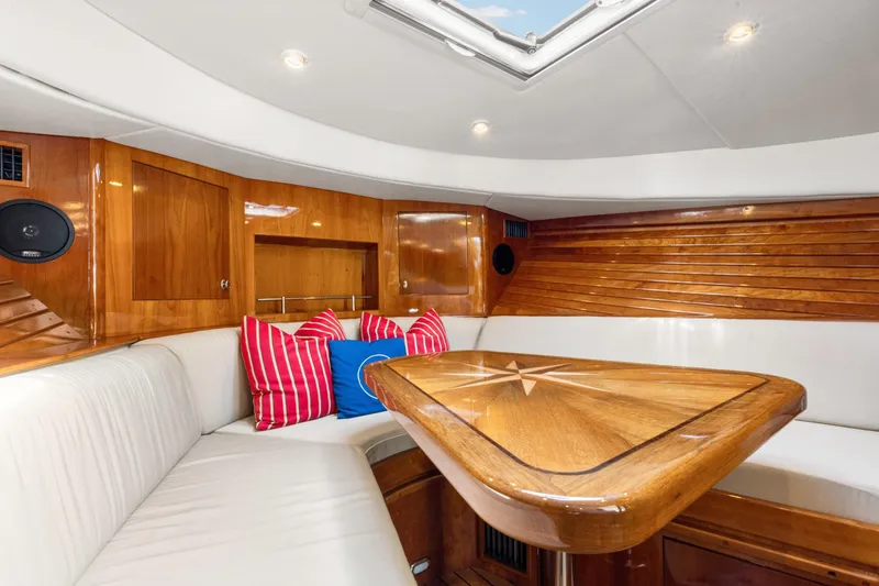 Slide: The Image of Luxurious interior of 2009 Hinckley Runabout 38 with wood accents and plush seating. - 11