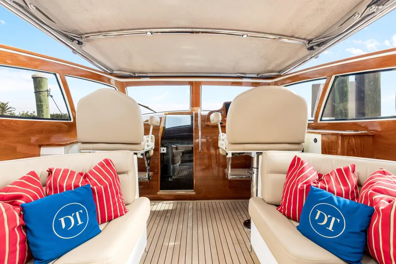 Slide: The Image of Luxurious 2009 Hinckley Runabout 38 interior with plush seating and vibrant cushions. - 9