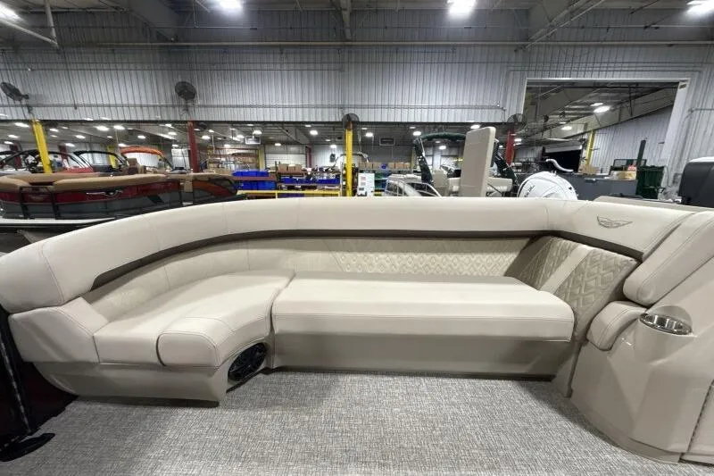 Slide: The Image of 2026 Bennington 24 MOFBSF pontoon boat interior with luxurious beige seating. - 15