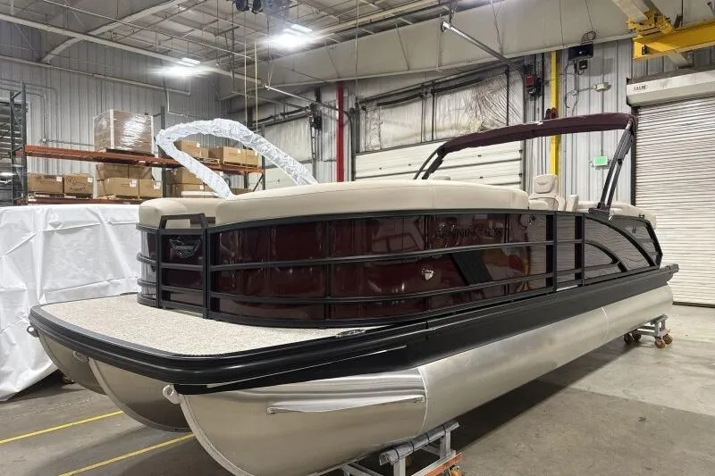 Slide: The Image of 2026 Bennington 24 MOFBSF pontoon boat in a warehouse setting. - 3