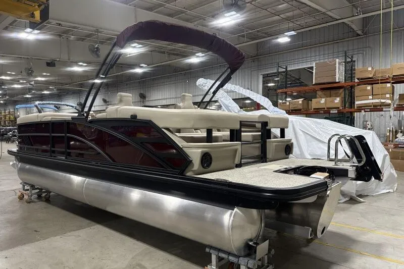 Slide: The Image of 2026 Bennington 24 MOFBSF pontoon boat in a warehouse setting. - 5