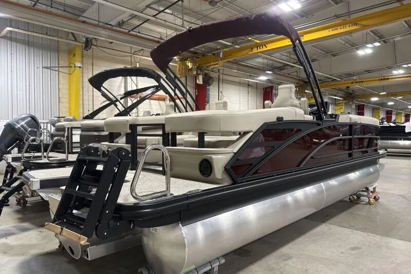 Slide: The Image of 2026 Bennington 24 MOFBSF pontoon boat in a factory setting. - 7