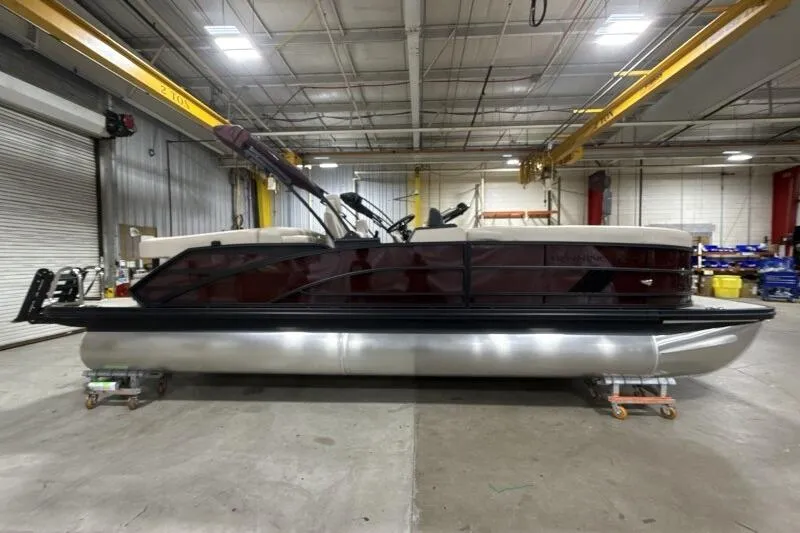 Slide: The Image of 2026 Bennington 24 MOFBSF pontoon boat in a warehouse setting. - 8