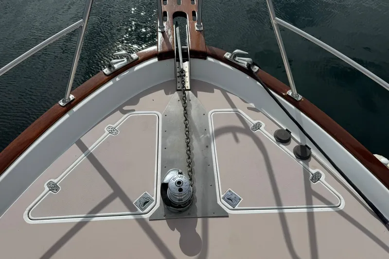 Slide: The Image of 2001 Legacy Soft Top boat deck with anchor chain and winch. - 13