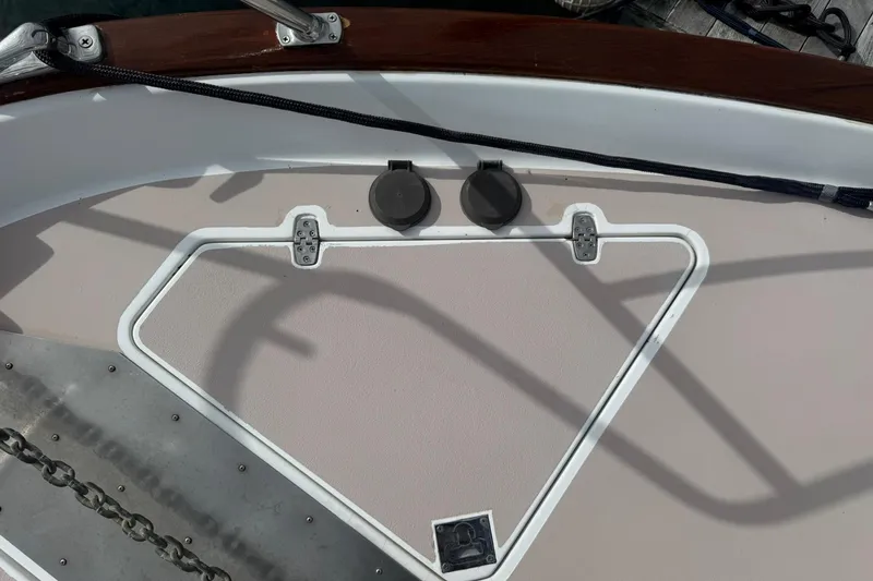 Slide: The Image of 2001 Legacy Soft Top boat deck with anchor chain and hatch cover. - 11