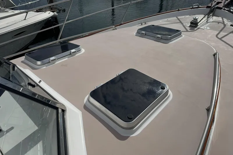 Slide: The Image of 2001 Legacy Soft Top boat deck with hatches, docked at marina. - 14