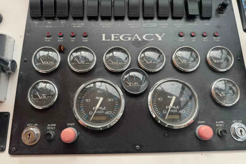 Slide: The Image of Control panel of a 2001 Legacy Soft Top with various gauges and switches. - 17