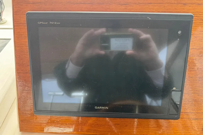 Slide: The Image of Garmin GPSMap 7612xsv on 2001 Legacy Soft Top boat dashboard. - 18