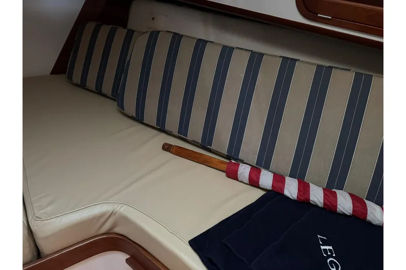 Slide: The Image of 2001 Legacy Soft Top interior with striped cushions and folded flag. - 39