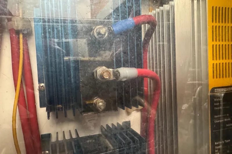 Slide: The Image of Electrical components and wiring inside a 2001 Legacy Yachts Express boat. - 88