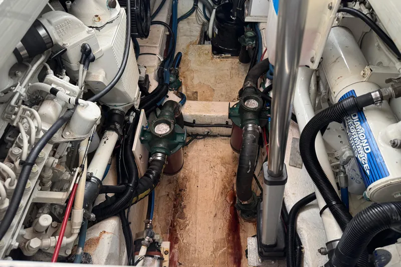 Slide: The Image of Engine room of 2001 Legacy Yachts Express, showcasing mechanical components and systems. - 93