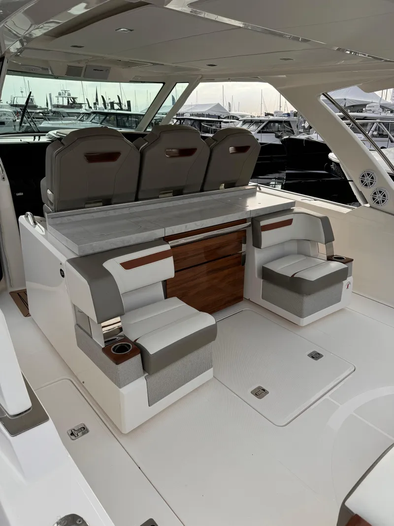 Slide: The Image of 2023 Tiara Yachts 38 LS interior with luxurious seating and modern design. - 10