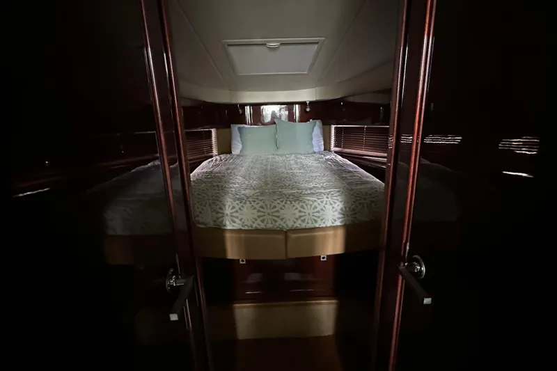 Slide: The Image of Luxurious bedroom interior of 2011 Sea Ray 470 Sundancer yacht. - 13