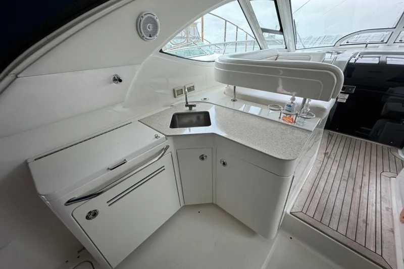 Slide: The Image of Luxurious 2011 Sea Ray 470 Sundancer yacht interior with kitchenette and sleek design. - 4