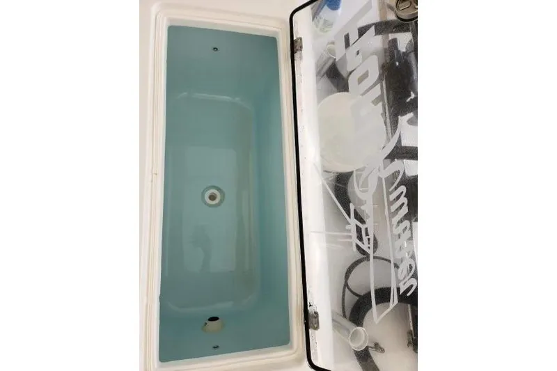 Slide: The Image of Open storage compartment of 2023 Front Runner 36 cc boat. - 10