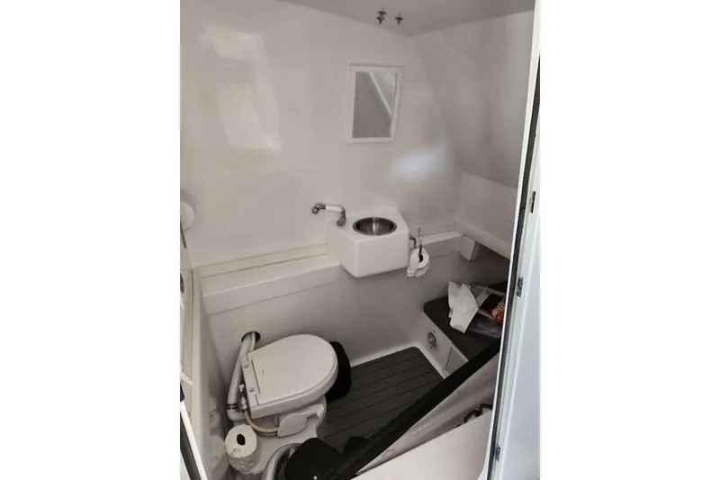 Slide: The Image of 2023 Front Runner 36 cc boat interior with toilet and sink. - 16