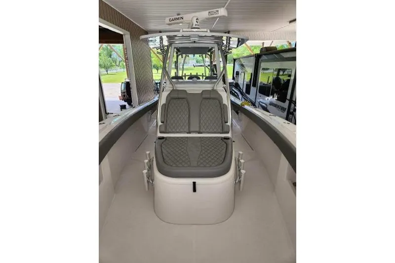 Slide: The Image of 2023 Front Runner 36 cc boat interior with cushioned seating and modern design. - 20