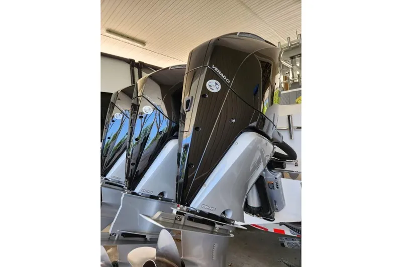 Slide: The Image of 2023 Front Runner 36 cc boat engines, featuring sleek Verado outboard motors in a showroom setting. - 3