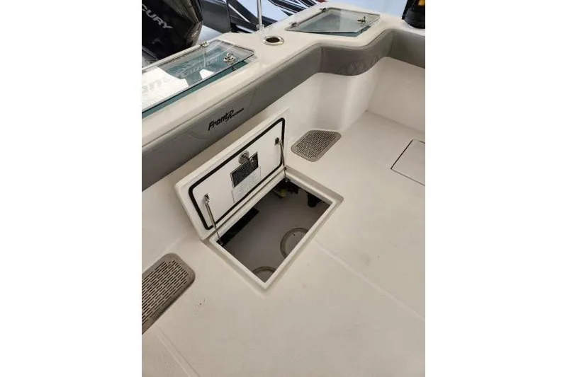 Slide: The Image of 2023 Front Runner 36 cc boat interior with open storage compartment. - 5