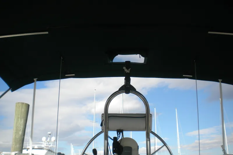 Slide: The Image of Cockpit view of 1997 Beneteau Oceanis 321 sailboat under a clear sky. - 14