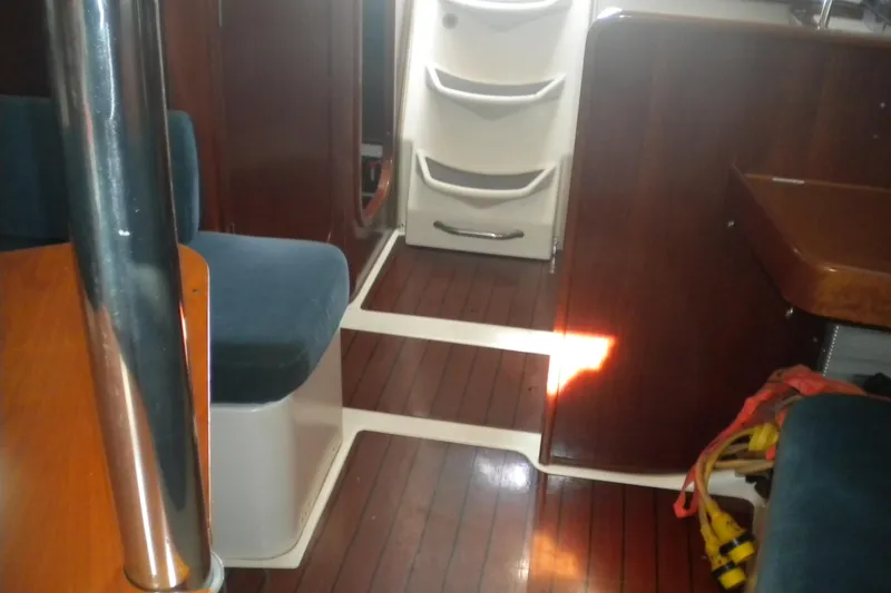 Slide: The Image of Interior of 1997 Beneteau Oceanis 321 sailboat with wood flooring and seating. - 23
