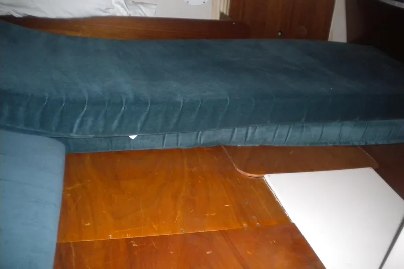 Slide: The Image of Interior cabin view of 1997 Beneteau Oceanis 321 sailboat with blue cushions. - 28