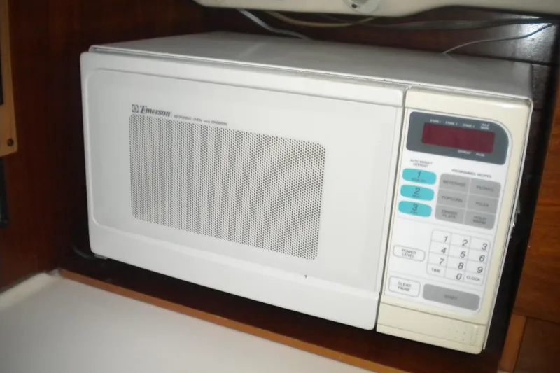 Slide: The Image of Microwave oven inside 1997 Beneteau Oceanis 321 yacht kitchen area. - 32