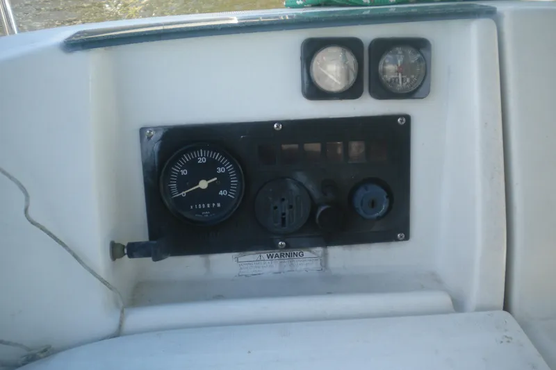 Slide: The Image of Control panel of a 1997 Beneteau Oceanis 321 sailboat with gauges and dials. - 36