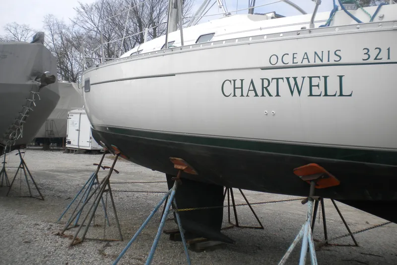 Slide: The Image of 1997 Beneteau Oceanis 321 sailboat "Chartwell" on stands in a boatyard. - 41
