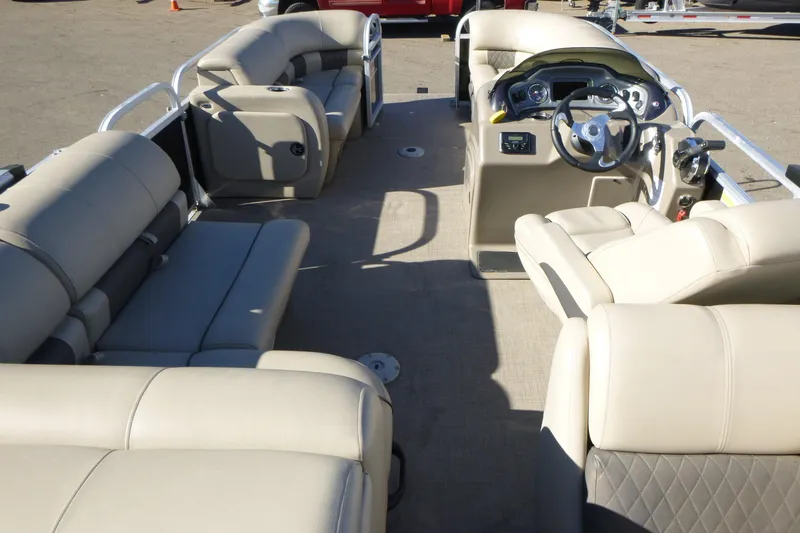 Slide: The Image of 2022 Sun Tracker Party Barge 22 DLX interior with spacious seating and modern helm. - 6
