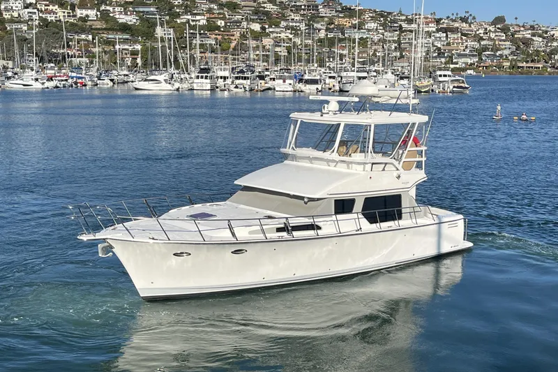 The Image of 2010 Mikelson 43 Sportfisher yacht cruising in a scenic marina. - 0