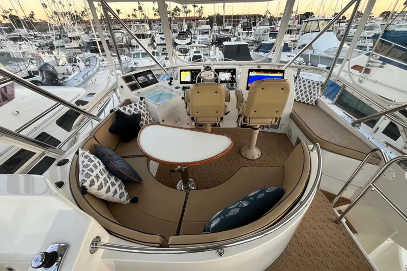 Slide: The Image of Luxurious 2010 Mikelson 43 Sportfisher yacht interior with helm and seating area. - 26