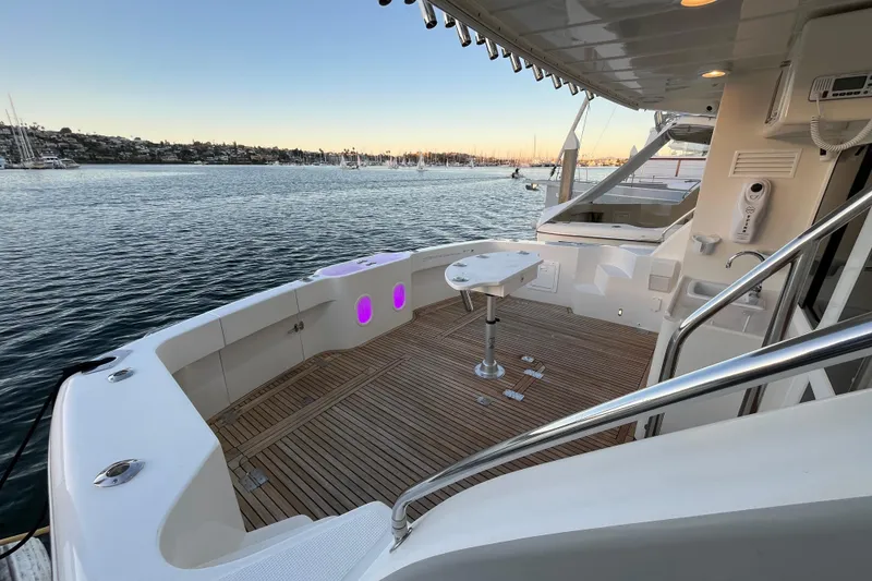 Slide: The Image of Mikelson 43 Sportfisher 2010 yacht deck with scenic harbor view at sunset. - 34