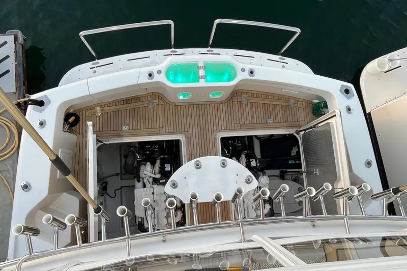 Slide: The Image of Overhead view of 2010 Mikelson 43 Sportfisher boat deck with open engine compartments. - 40